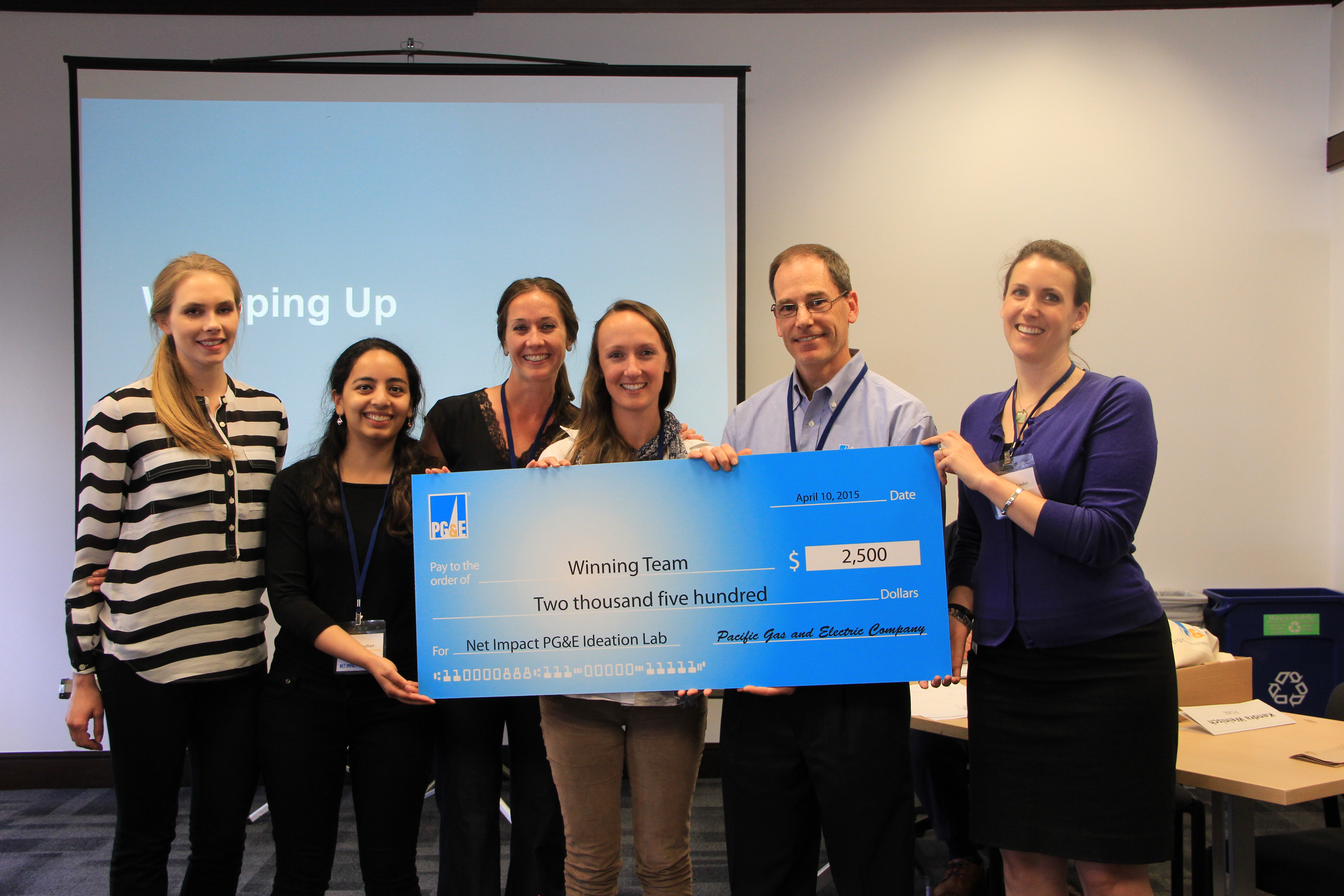 Student winners of the PG&E Energy Ideation Lab received a big check for their Net Impact chapter.